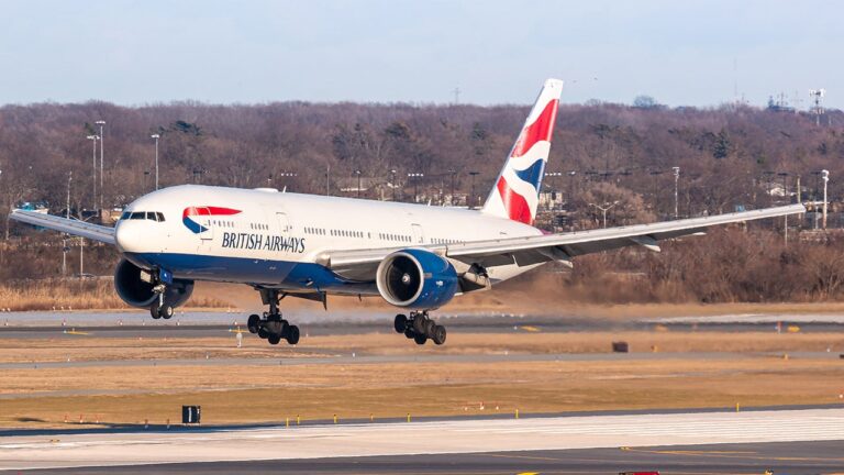 A British Airways crew member accidentally deploys an emergency slide at an airport.