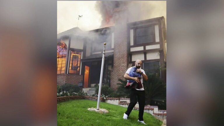 Russian rescues American flag outside burning house in Altadena, California.