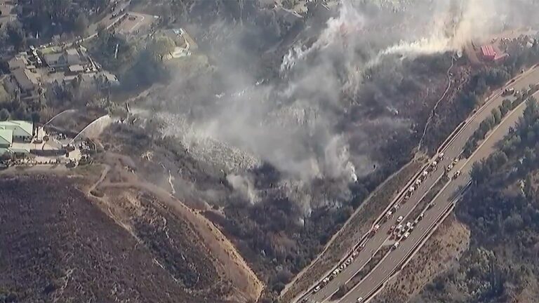 A new brush fire threatens homes in California